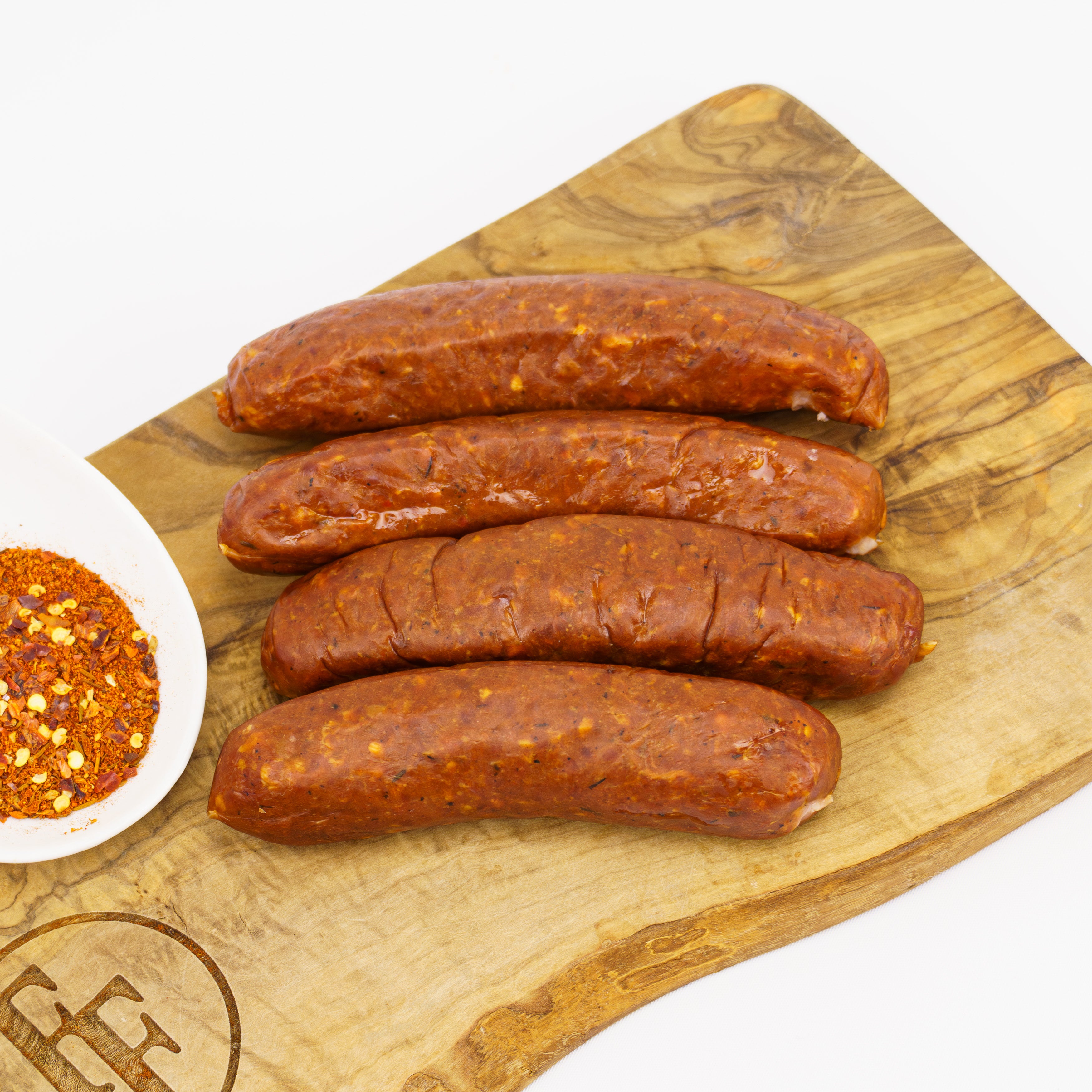 four raw alligator sausages