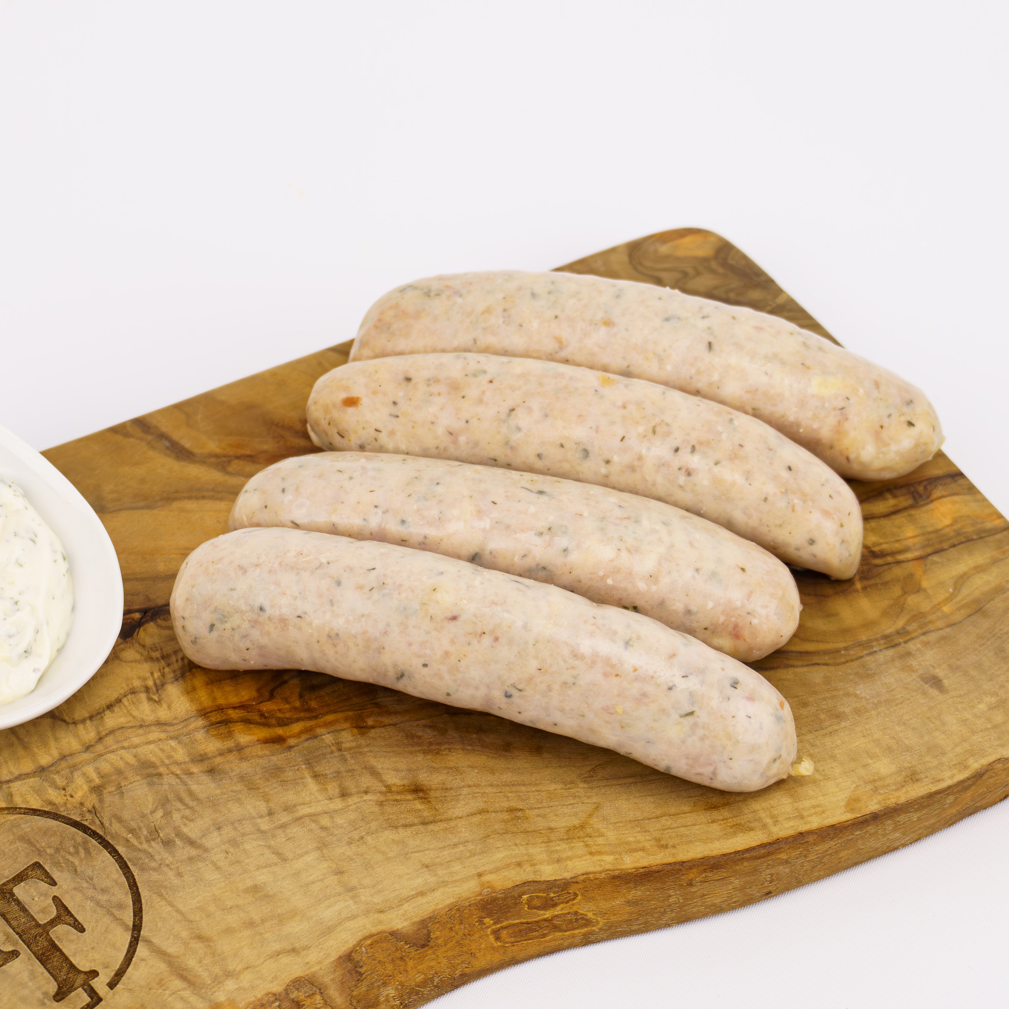 four raw chicken sausages