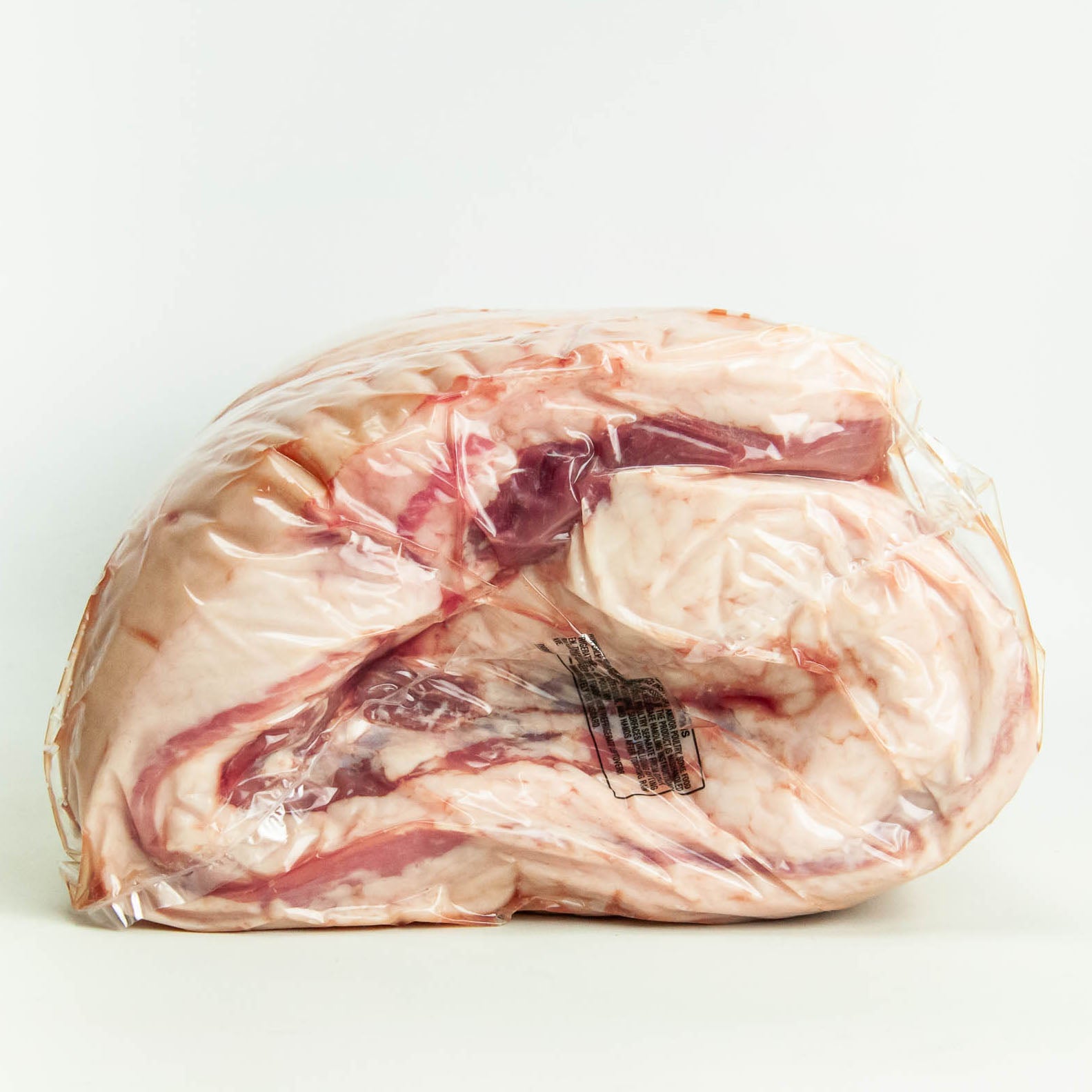 Packaged raw meat on a white background