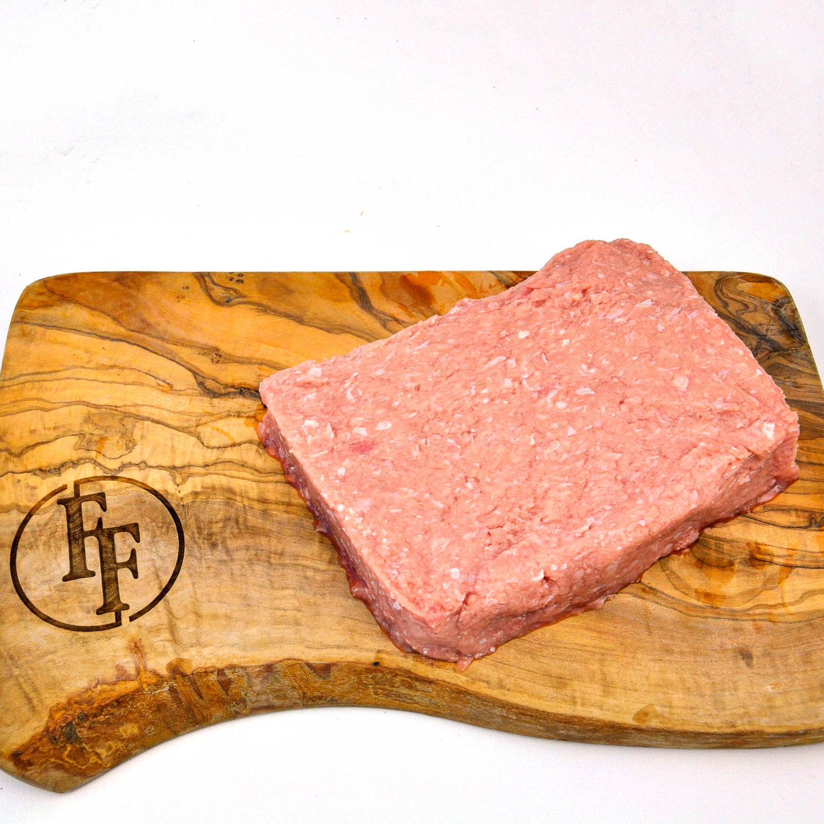 Raw ground meat on a wooden cutting board with a logo, on a white background