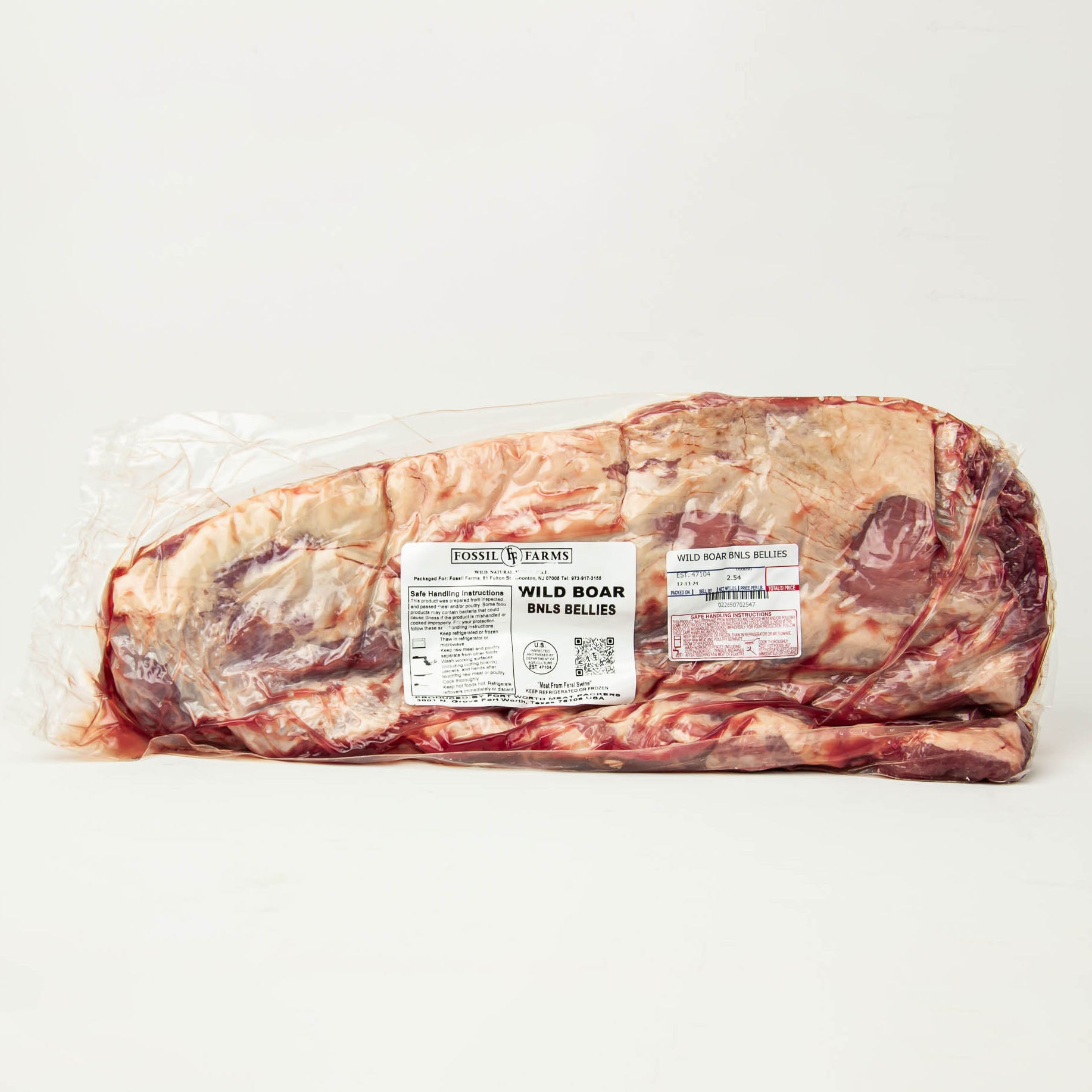 Raw wild boar belly with a label on a white background