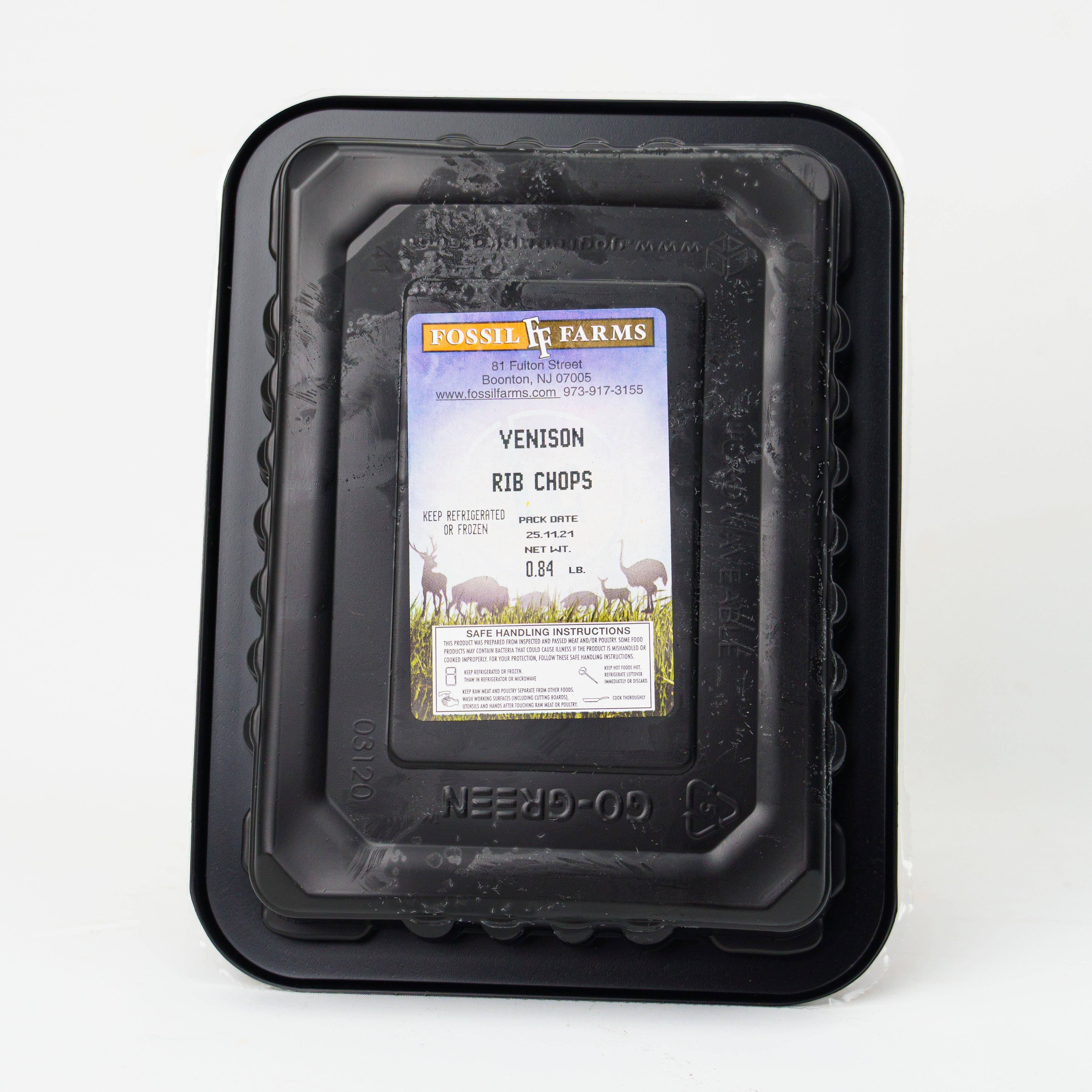 Black plastic packaging with a label for Fussell Farms venison rib chops on a white background