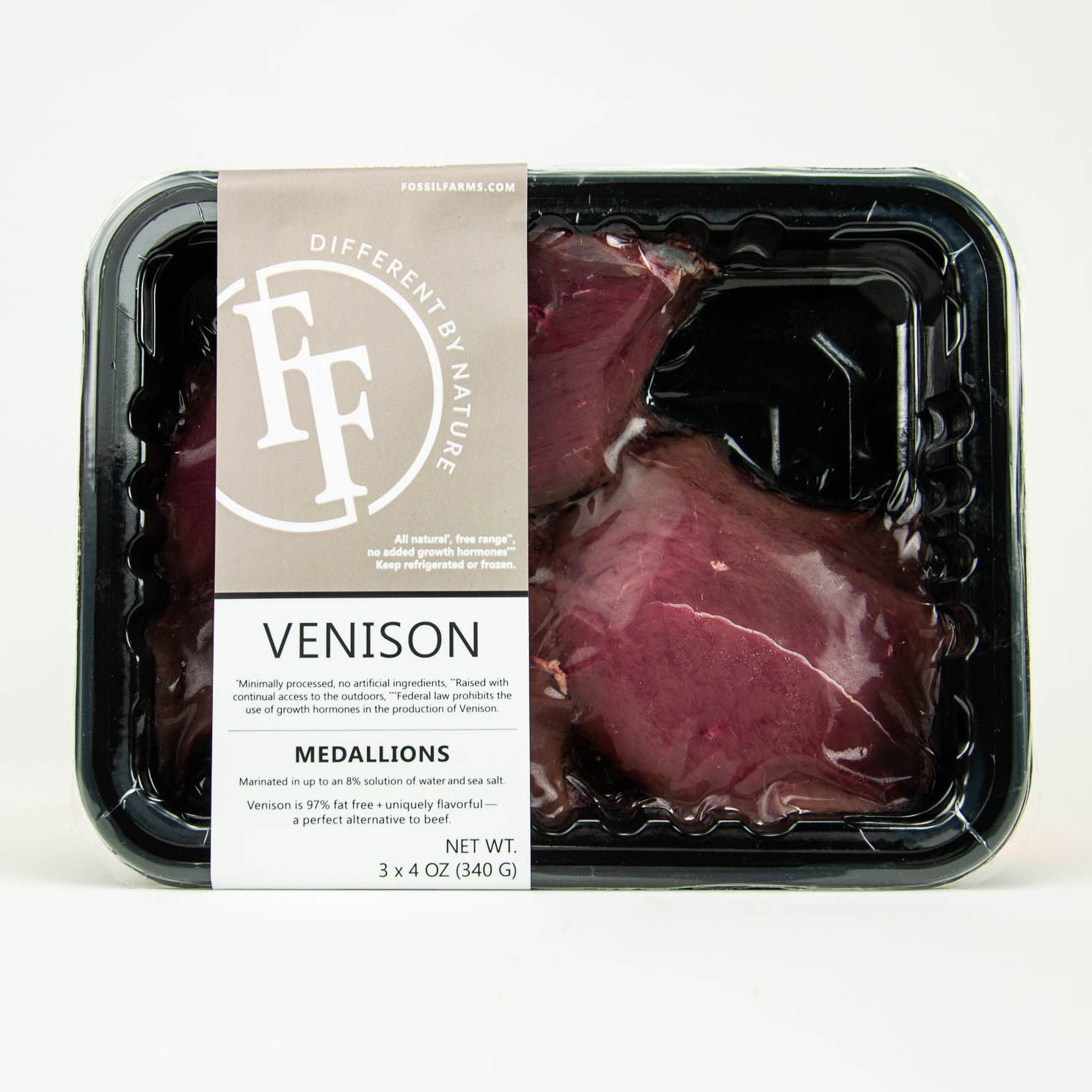 Packaged venison medallions with a label on a white background