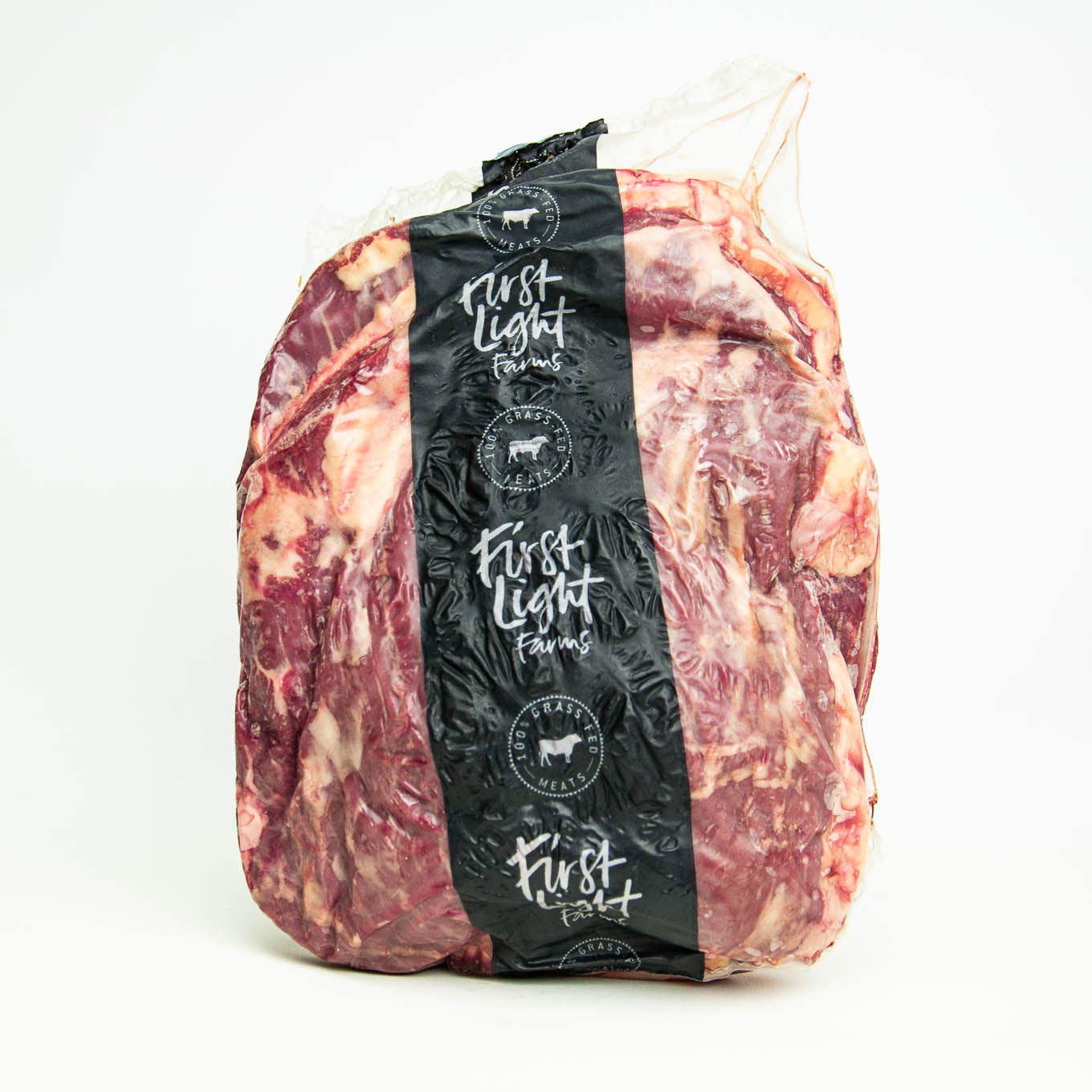Packaged meat with 'First Light Farms' label on a white background