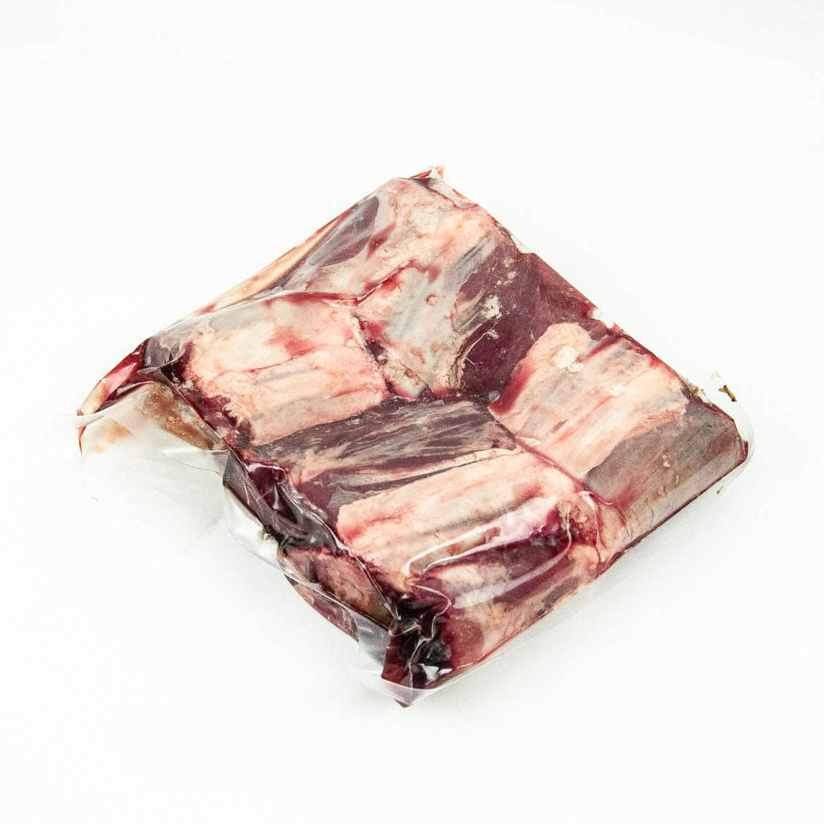 Packaged raw meat on a white background