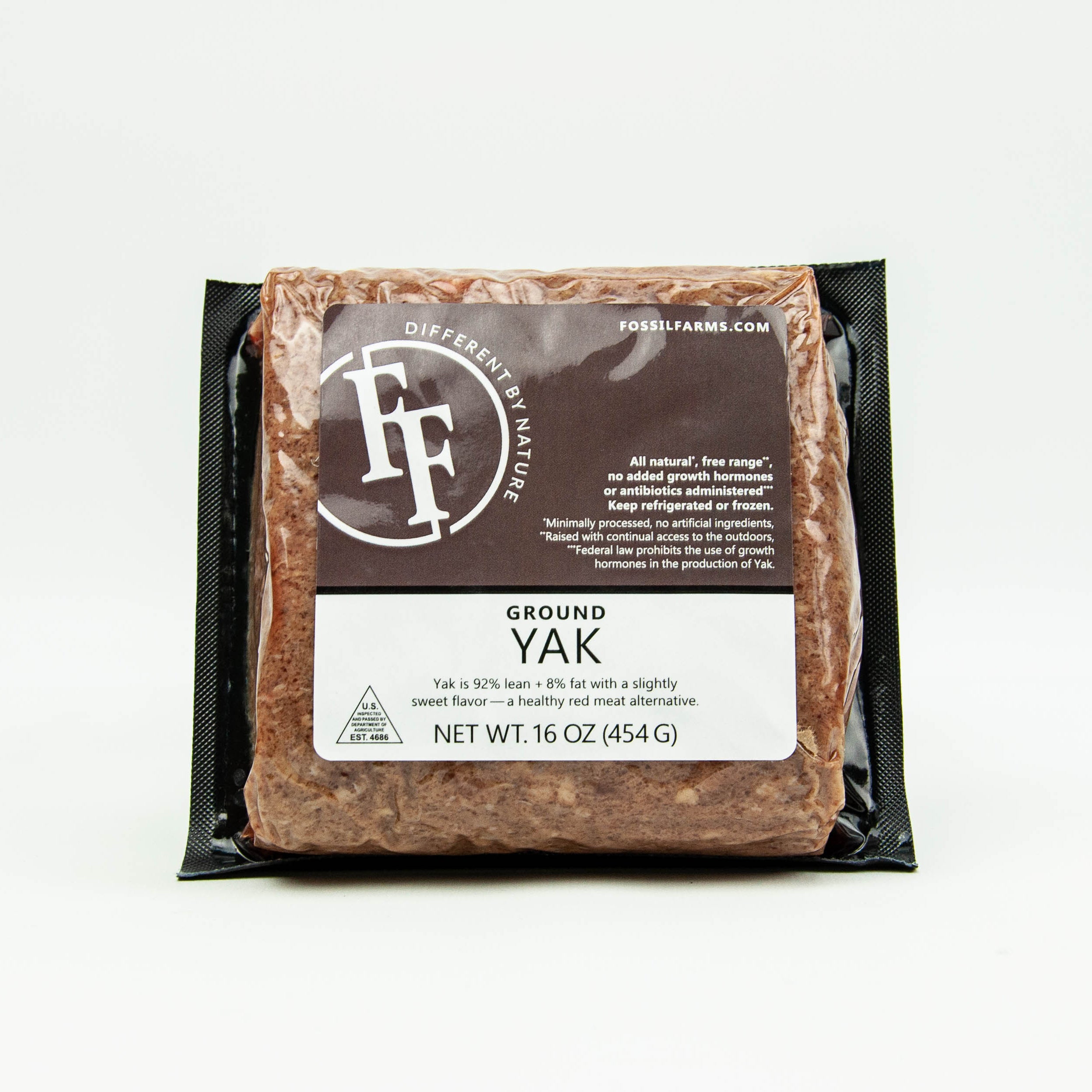 Packaged ground yak meat with Fossil Farms branding on a white background