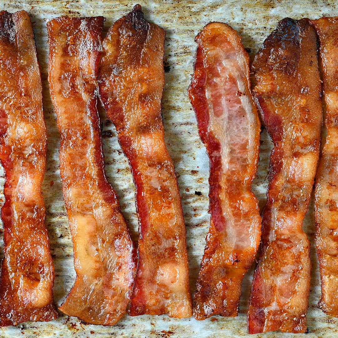 Bacon strips on a baking tray