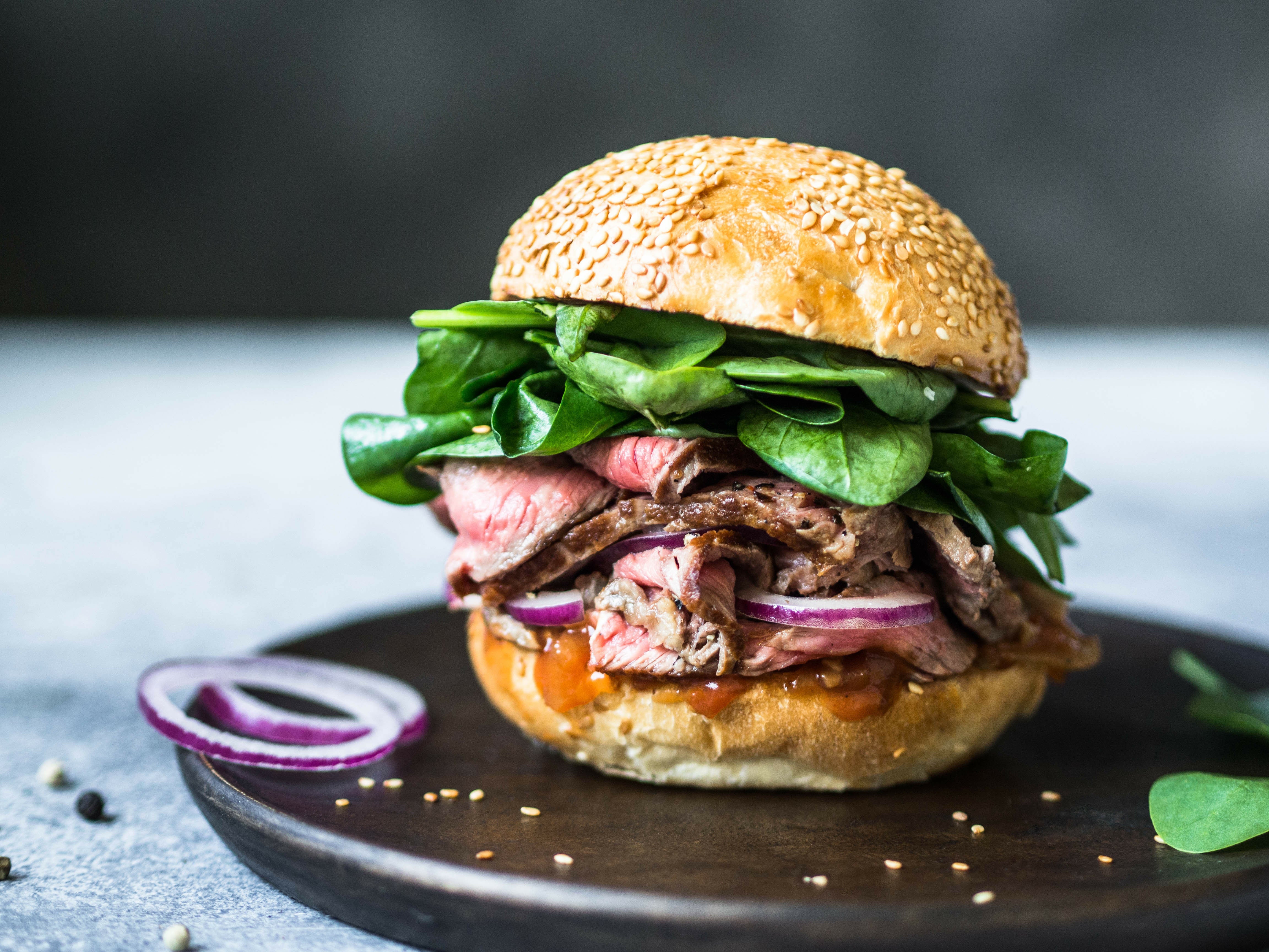 Bison Ribeye Sandwich with Fresh Spinach & Red Onions