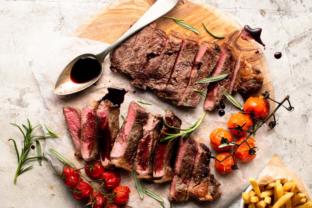 Grilled Bison NY Strip Steaks Marinated in Red Wine
