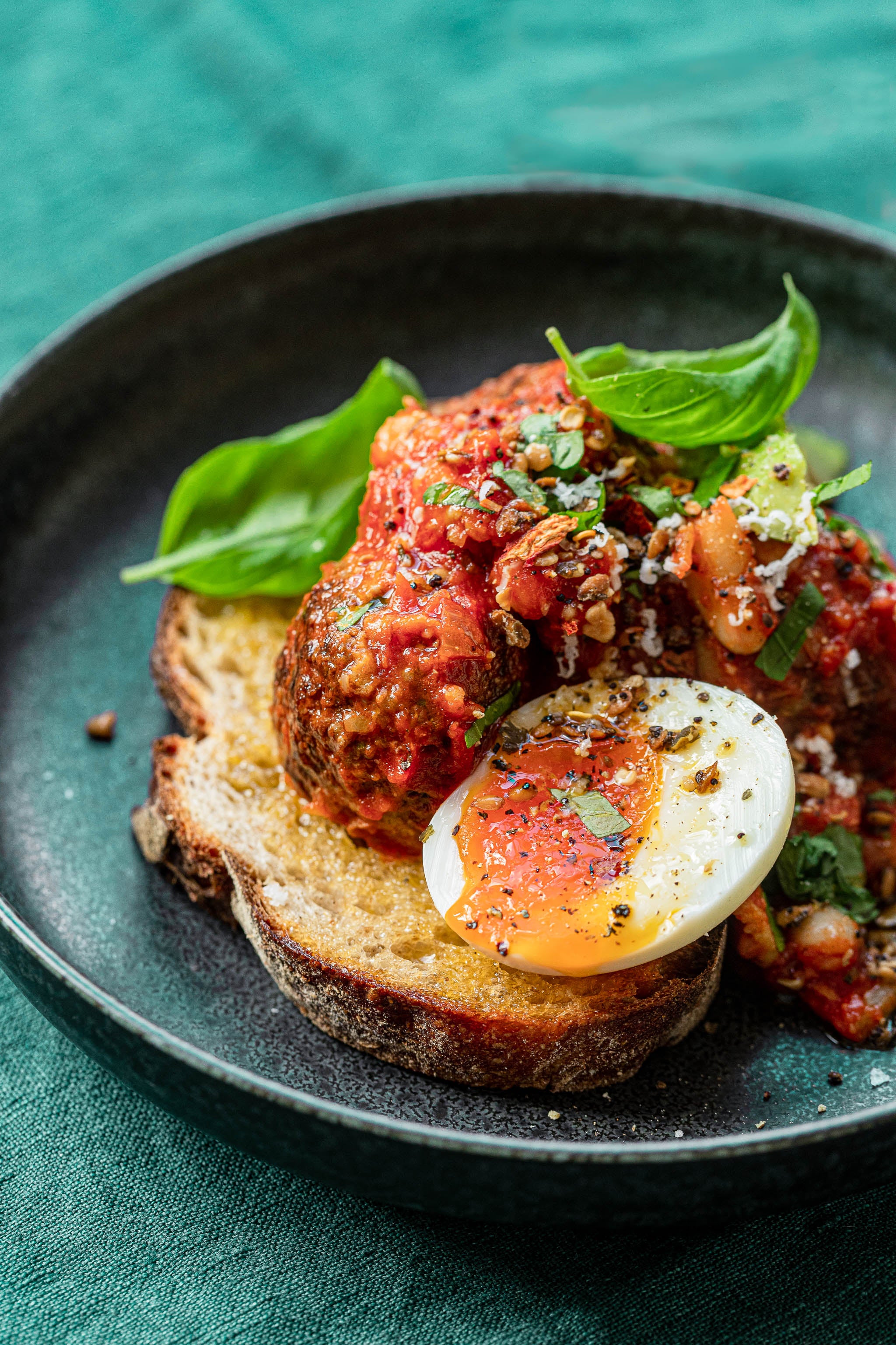 Ostrich Amore Meatballs with Tomato Sauce, Runny Yolk Eggs, & Fresh Basil