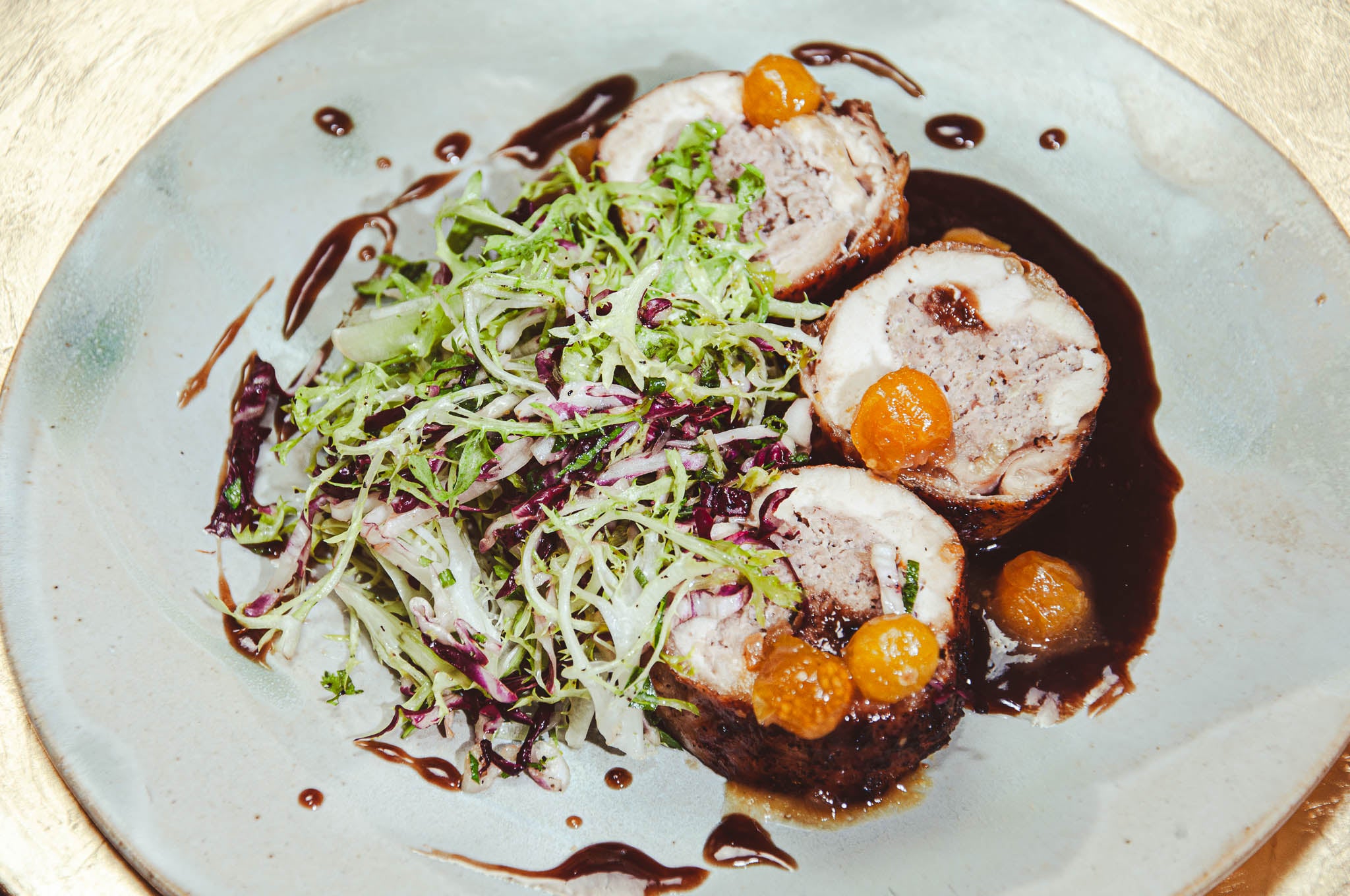 Fossil Farms Partridge Roulade with Pear Vinaigrette Frisée Salad