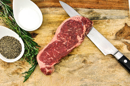 local angus beef strip steak raw