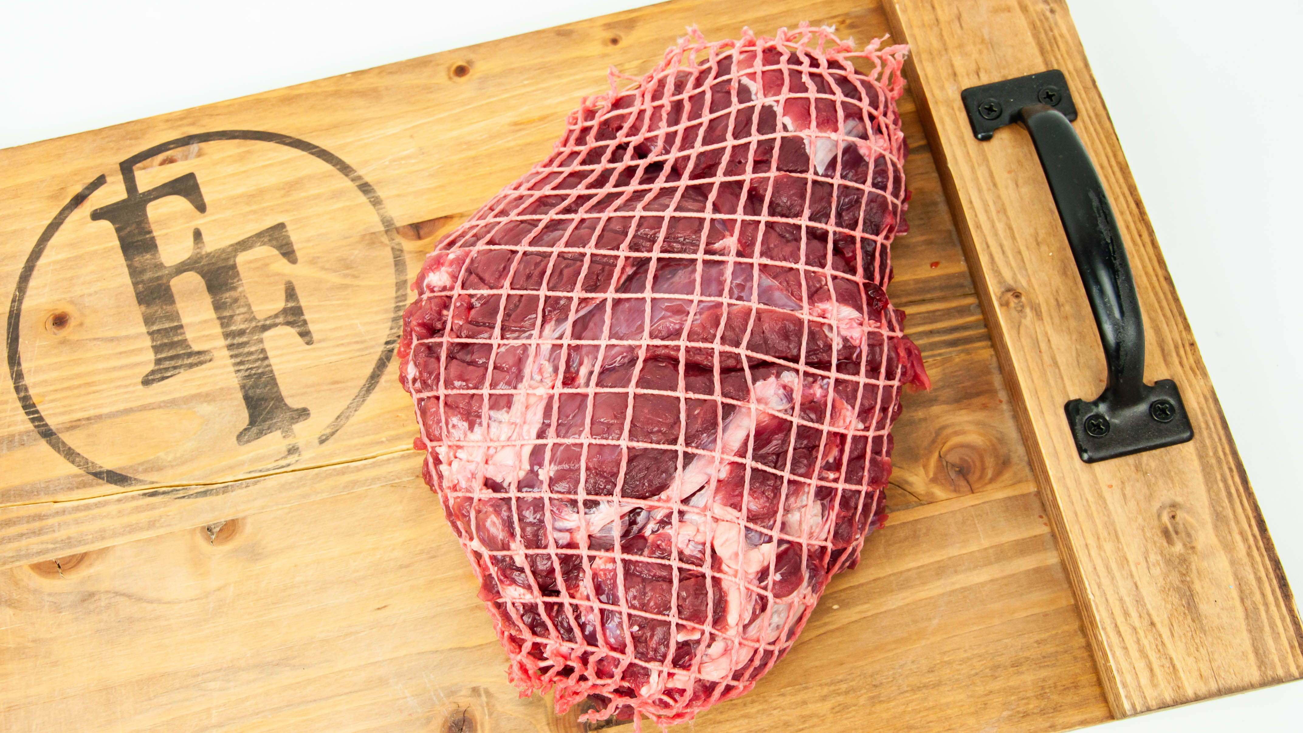 Wild Boar Shoulder Roast Tied Raw Close Up