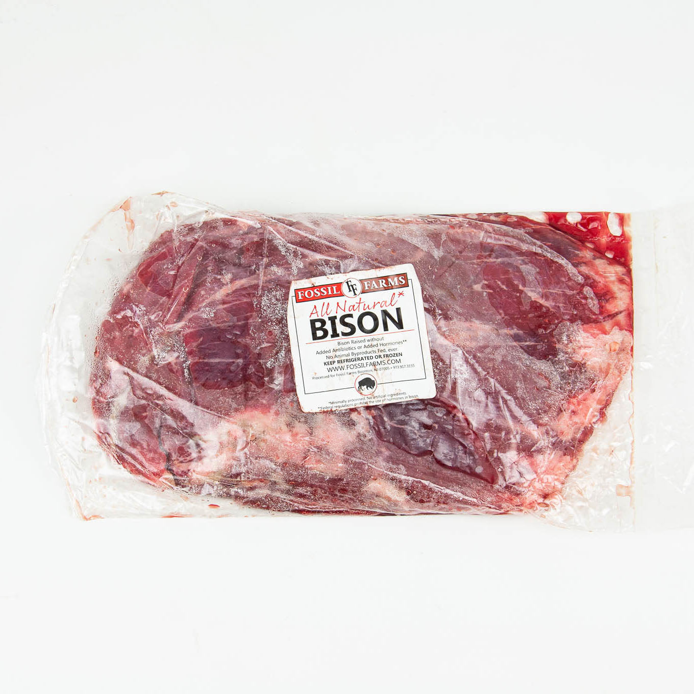 Packaged bison meat with a label on a white background
