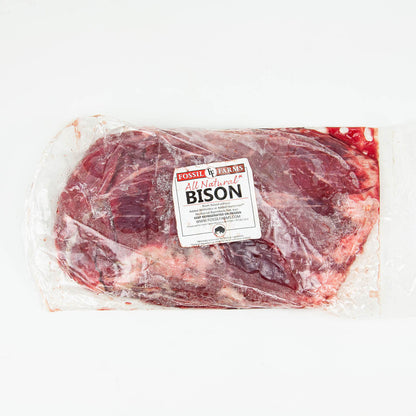 Packaged bison meat with a label on a white background