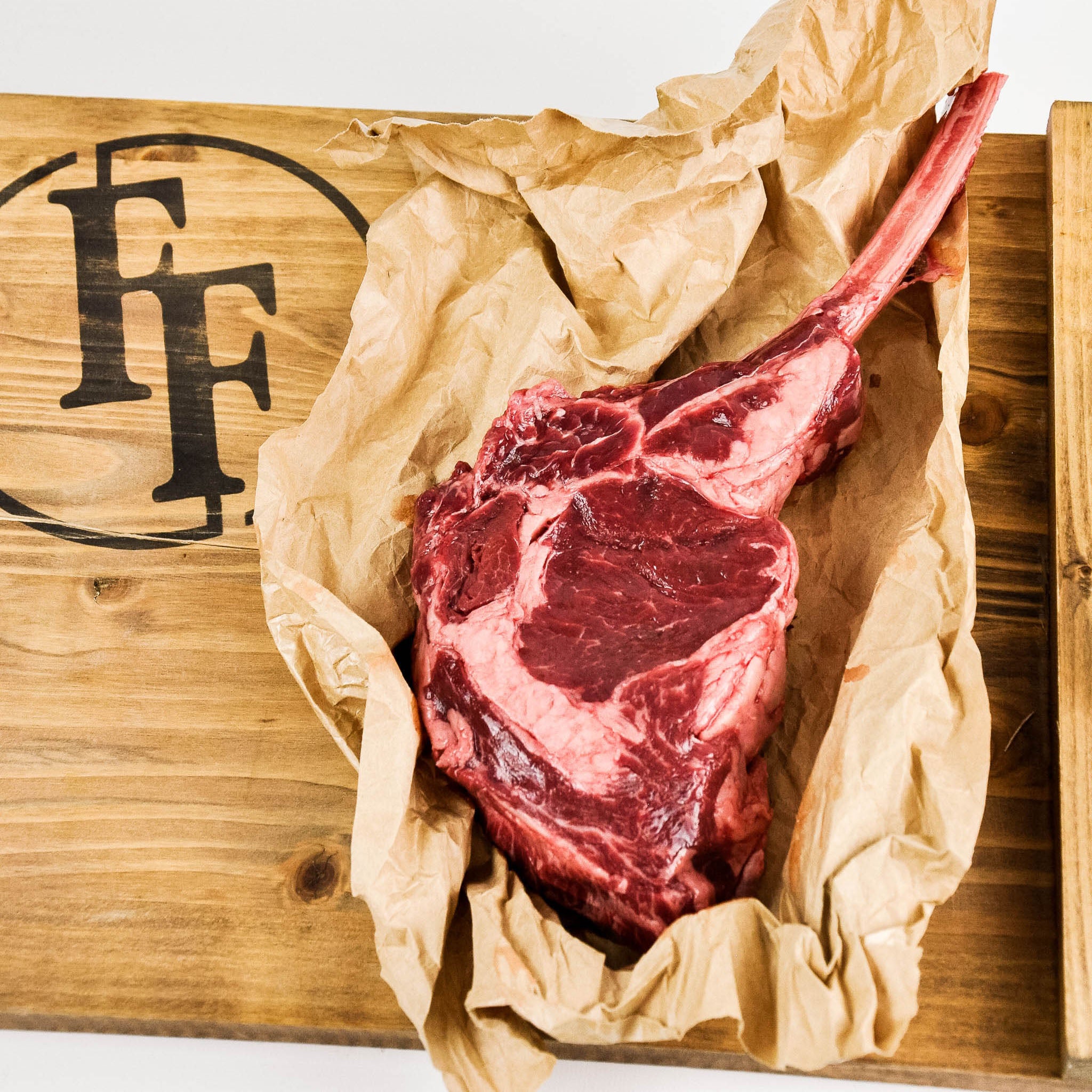 raw bison tomahawk steak