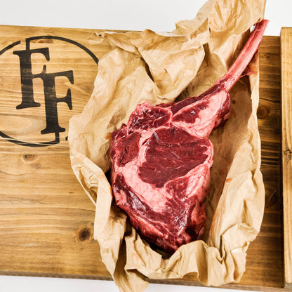 raw bison tomahawk steak