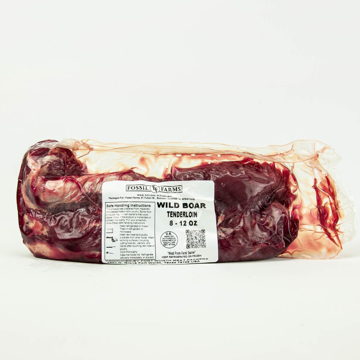 Packaged wild boar tenderloin with a label on a white background