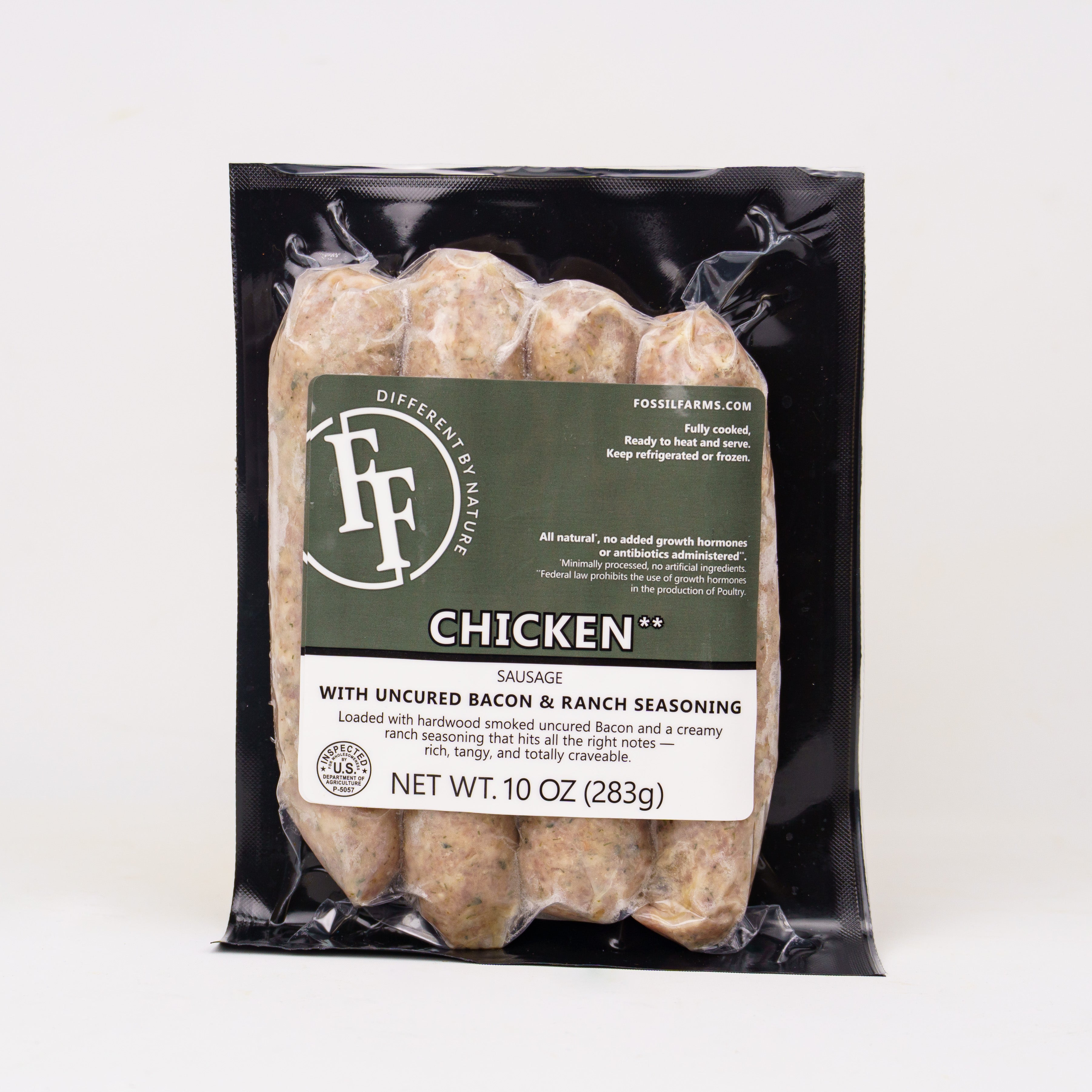 Packaged chicken sausage with Fossils Farms label on a white background