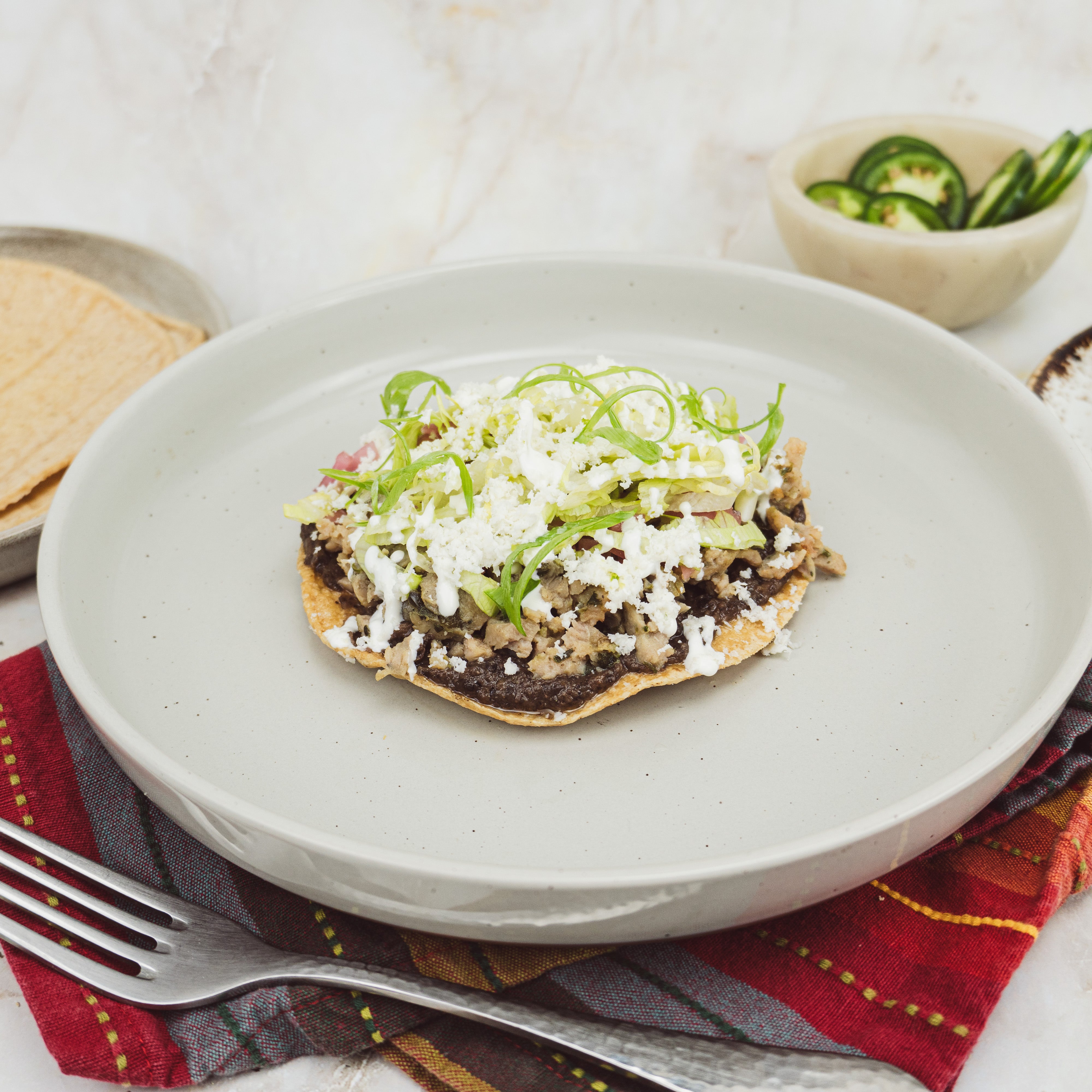 a chicken chorizo verde sausage tostada