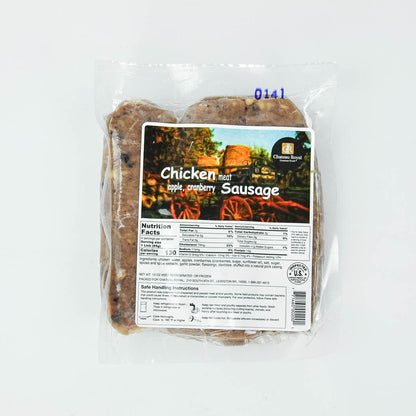 Packaged chicken meat apple cranberry sausage with a label on a white background
