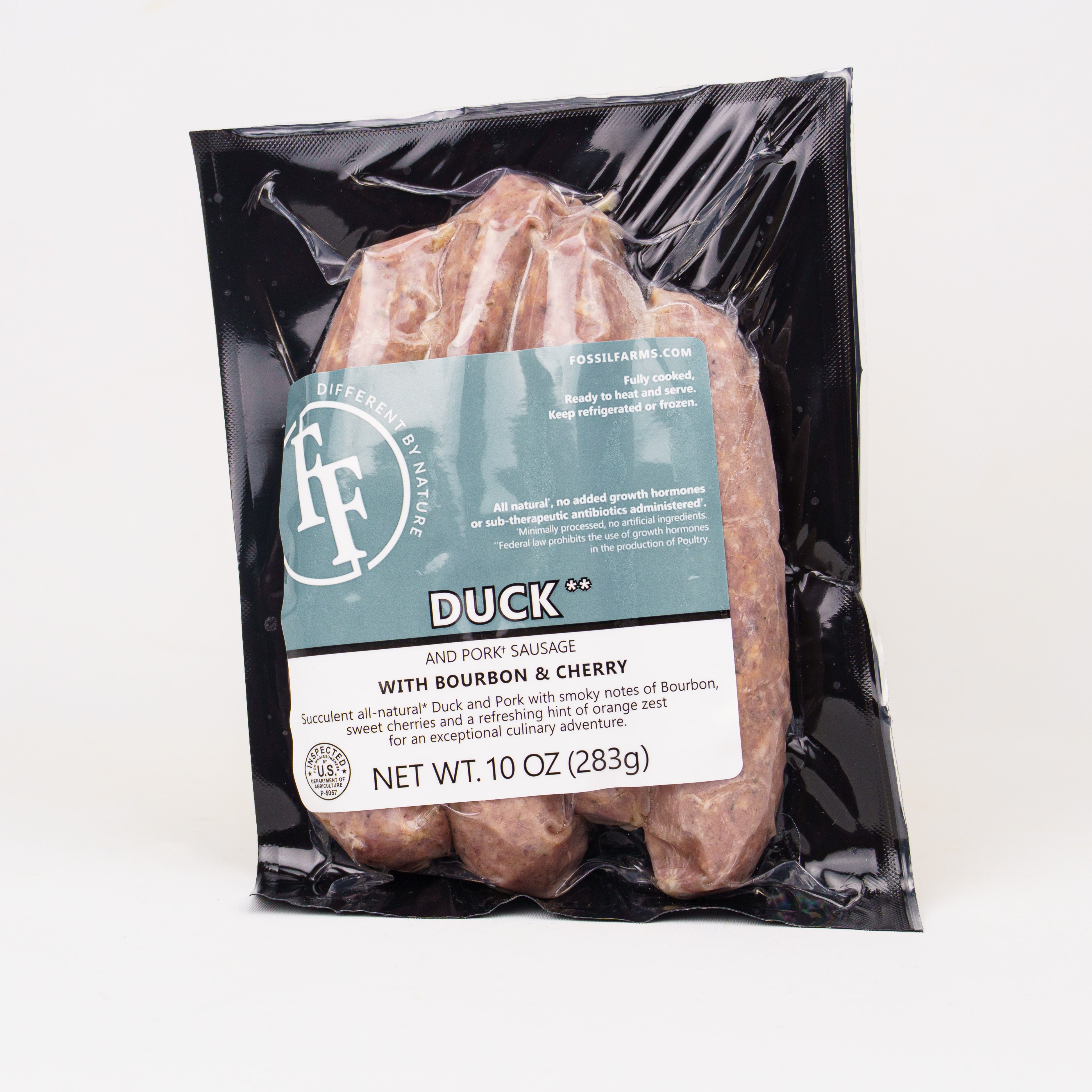 Packaged duck and pork sausage with bourbon and cherry flavor on a white background