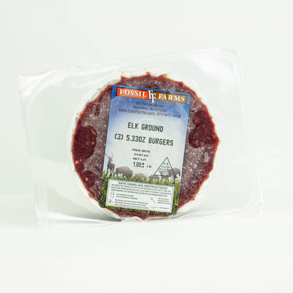 Packaged elk ground burgers with Fossil Farms label on a white background