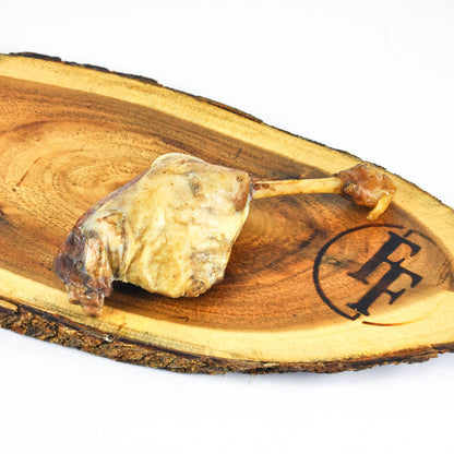 Wooden board with a piece of oyster on a stick and a logo on a white background