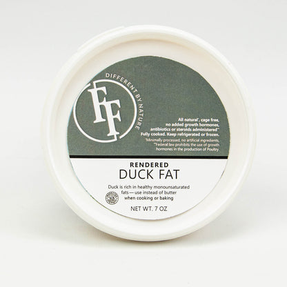 Jar of rendered duck fat with a label on a white background