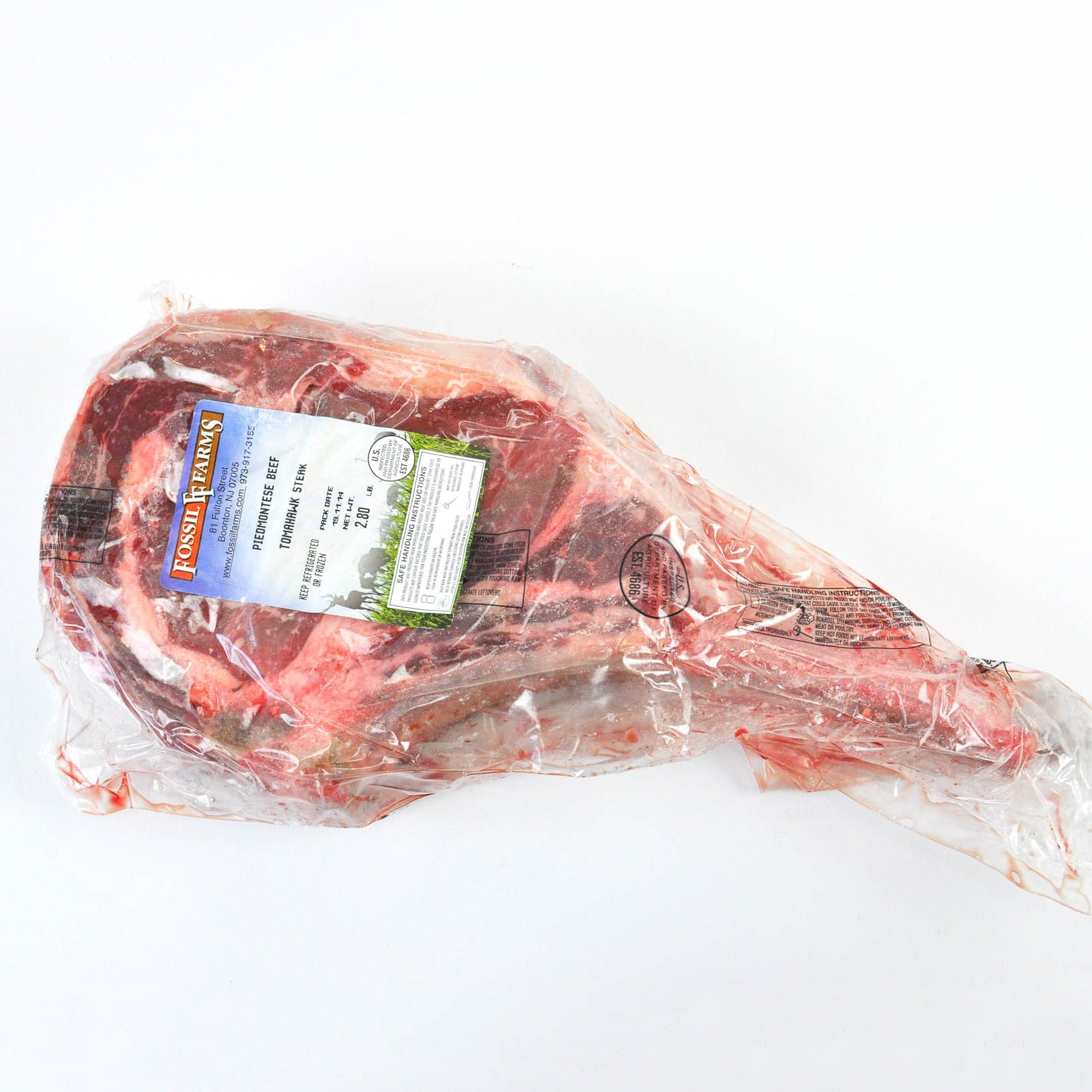 Packaged meat with a label on a white background