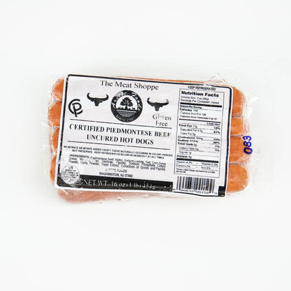 Packaged hot dogs with a label on a white background