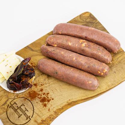 four raw venison sausages