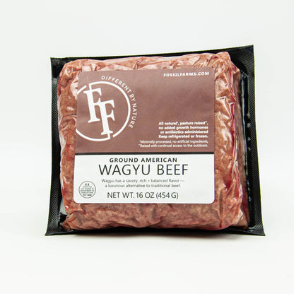 Packaged ground American Wagyu beef with Fossil Farms label on a white background