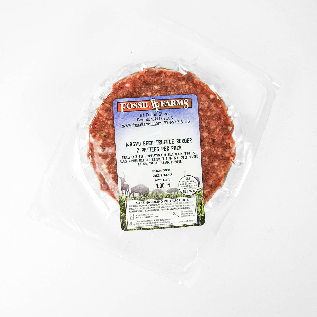 Packaged beef truffle burger with a label on a white background