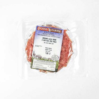 Packaged ground wild boar meat with Fossil Farms label on a white background