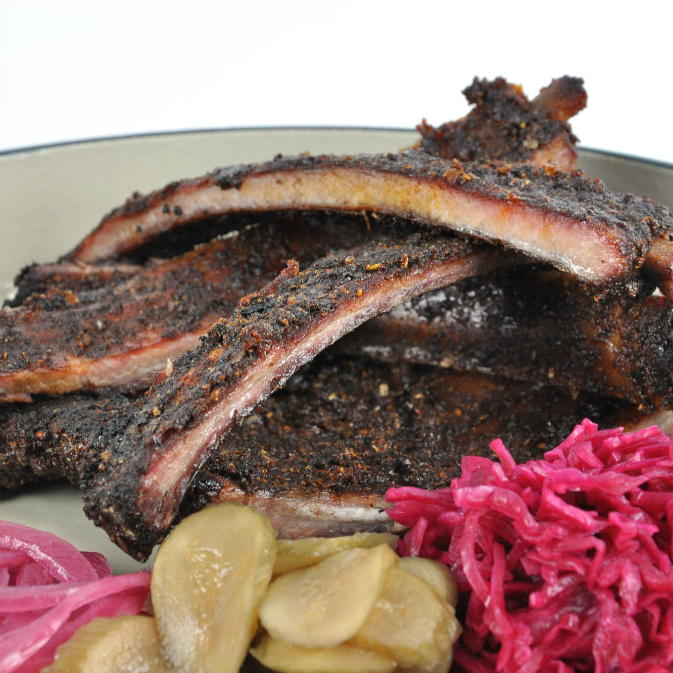 Ribs with pickles and sauerkraut on a plate